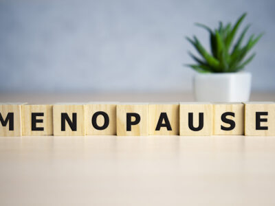 menopause word written on wood block. menopause text on table, concept