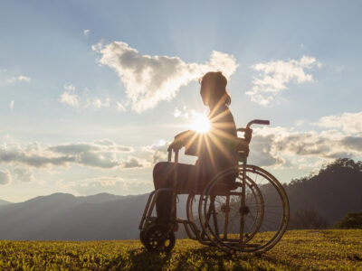 Disabled,Handicapped,Woman,Is,Sitting,On,Wheelchair,At,Sunset.